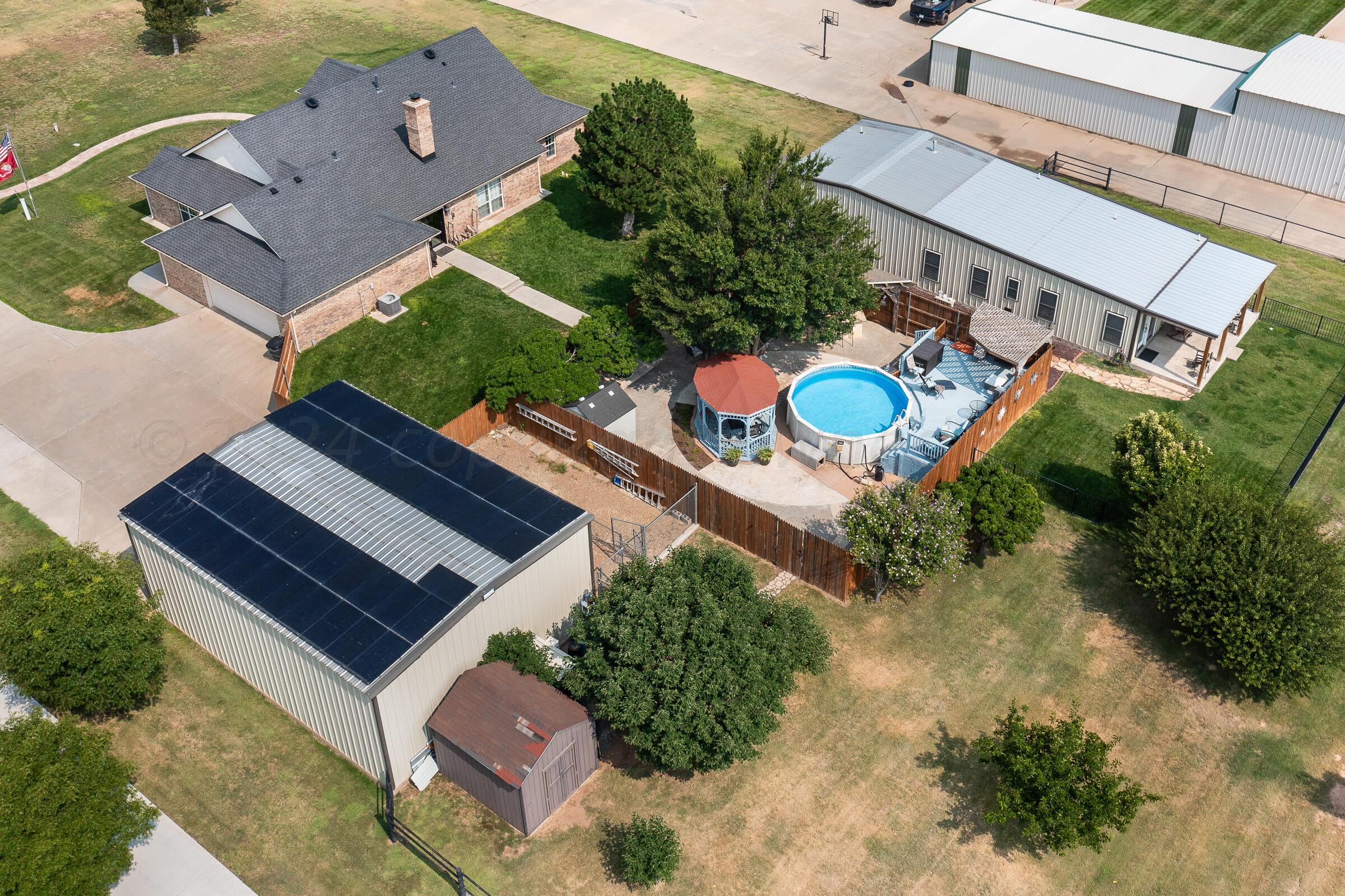8921 Greyhawk Road Amarillo, TX 79119 - Photo 23 of 56 an aerial view of a house