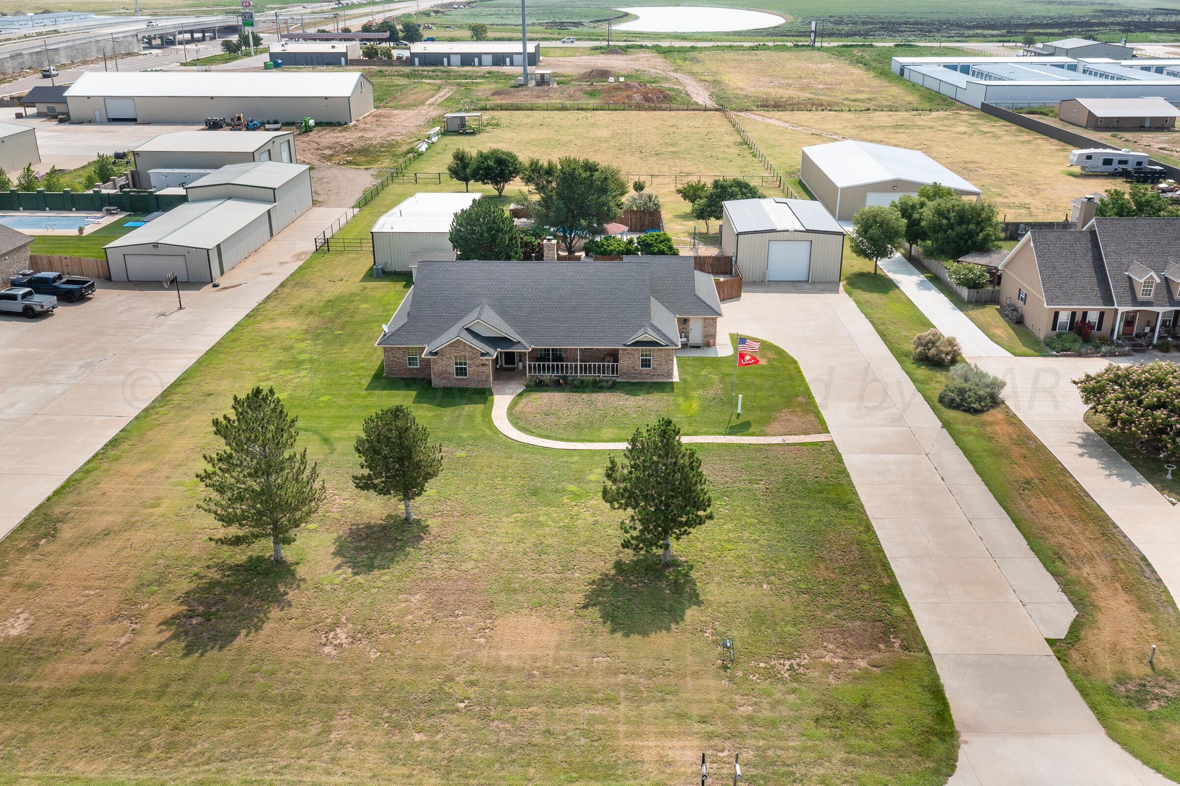 8921 Greyhawk Road Amarillo, TX 79119 - Photo 26 of 56 a view of a swimming pool with a patio
