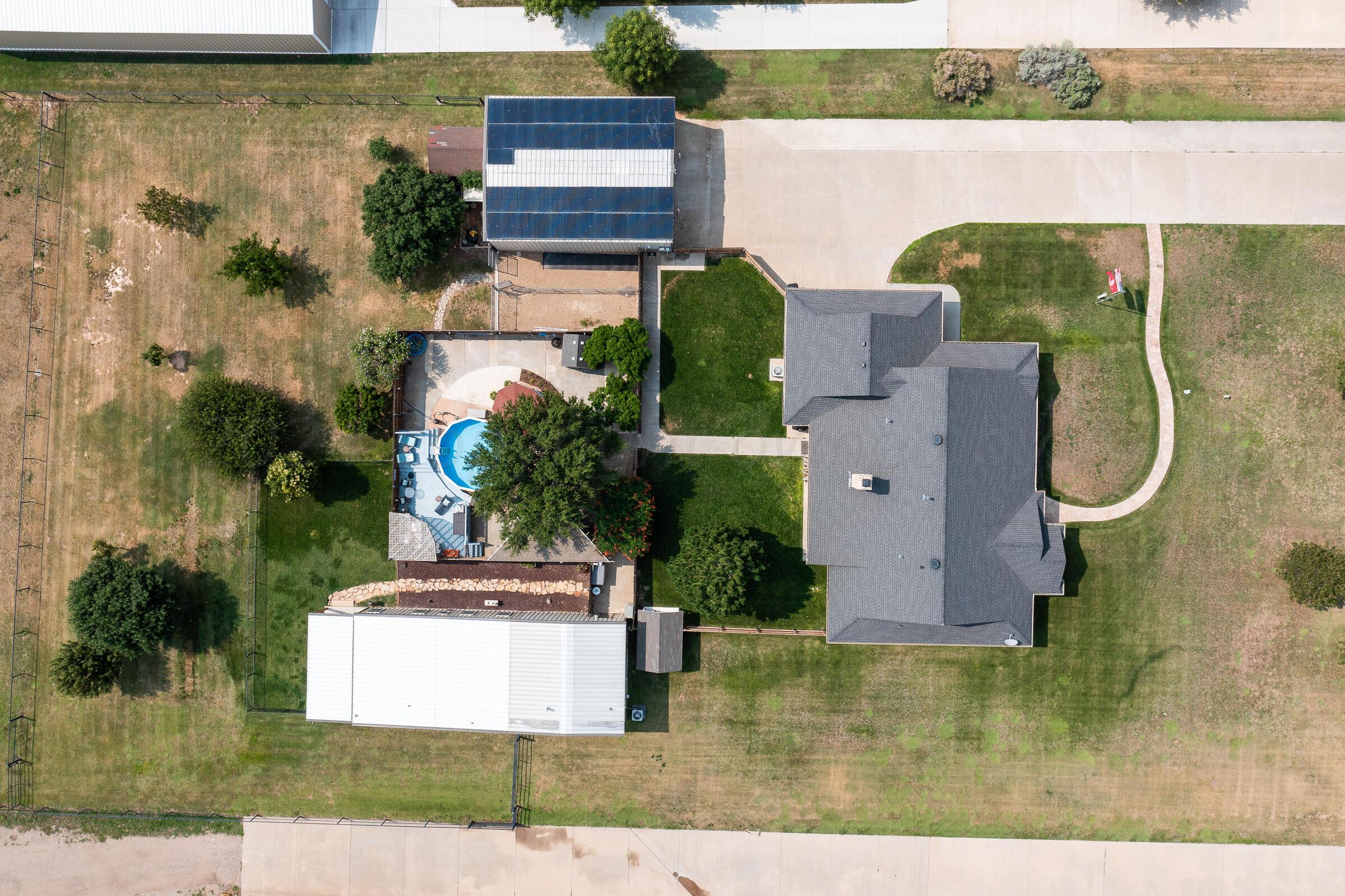 8921 Greyhawk Road Amarillo, TX 79119 - Photo 28 of 56 an aerial view of a house with pool patio and outdoor seating