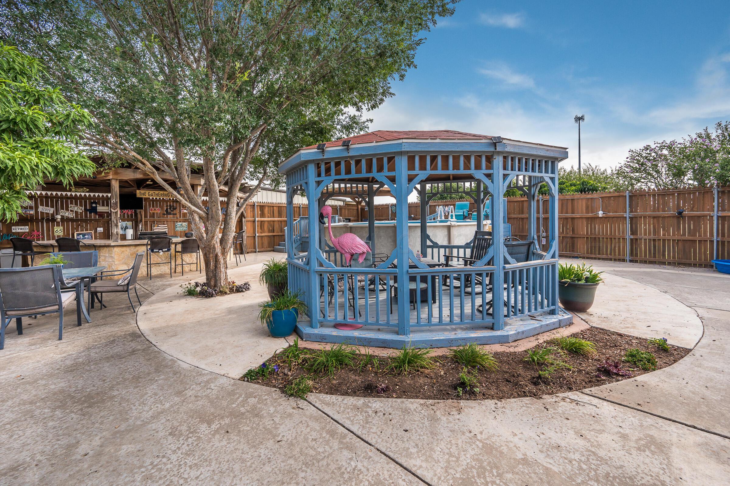 8921 Greyhawk Road Amarillo, TX 79119 - Photo 46 of 56 a view of a bench with iron fence