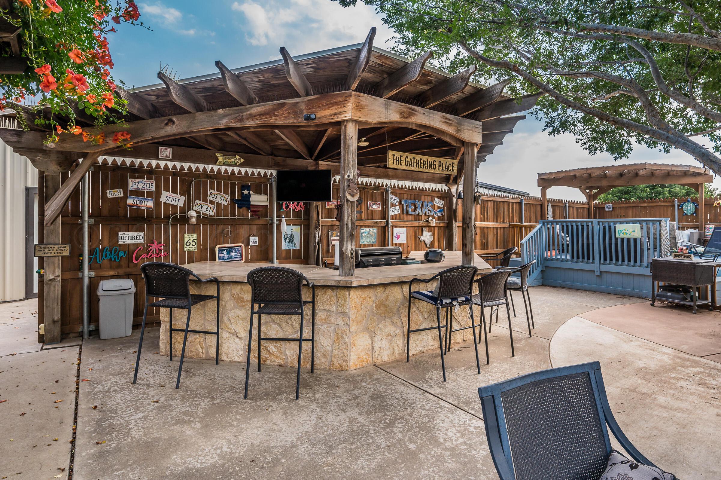 8921 Greyhawk Road Amarillo, TX 79119 - Photo 48 of 56 a view of a chairs and tables in patio