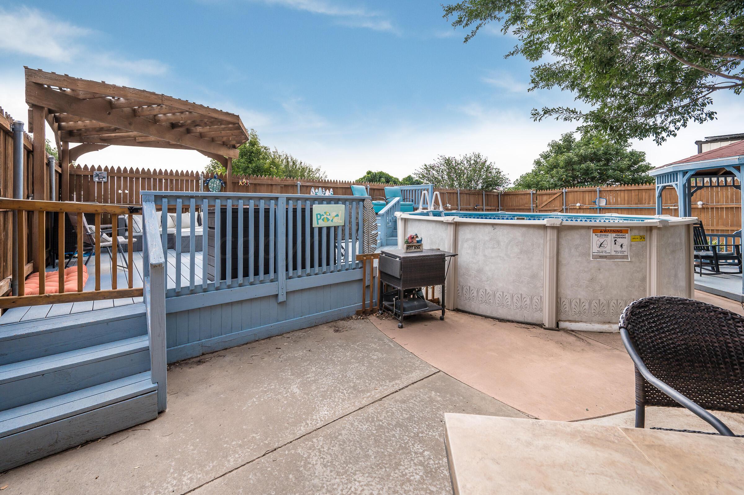 8921 Greyhawk Road Amarillo, TX 79119 - Photo 50 of 56 a balcony with furniture and a swing
