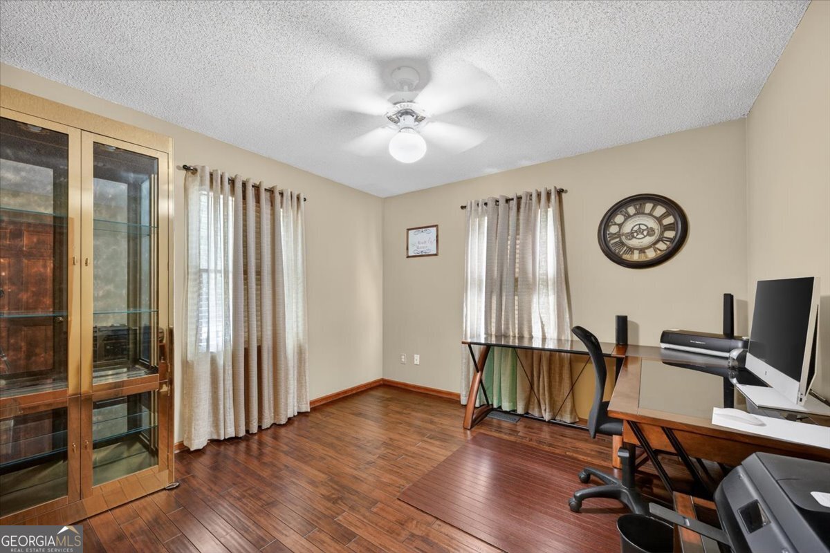 348 Craig Road Forsyth, GA 31029 - Photo 11 of 35 a view of a livingroom with furniture and hardwood floor