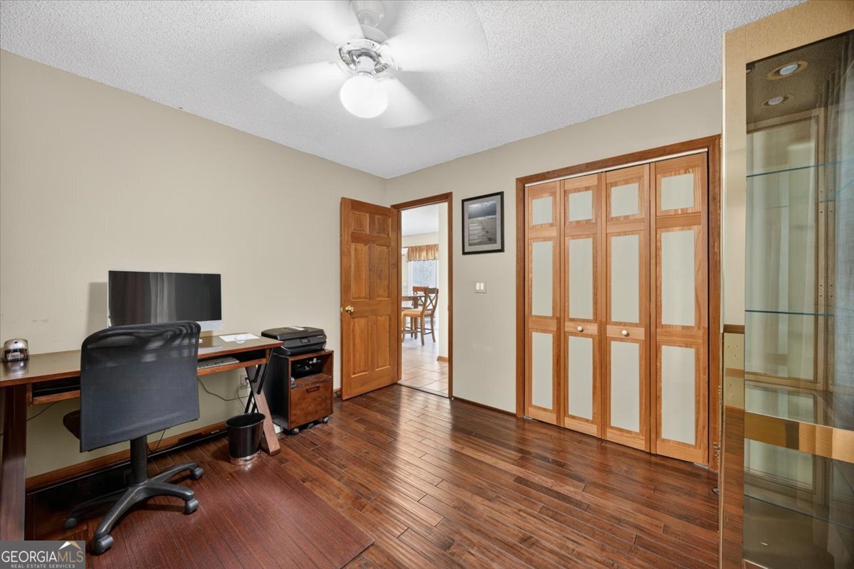 348 Craig Road Forsyth, GA 31029 - Photo 12 of 35 a view of a workspace with furniture and a window