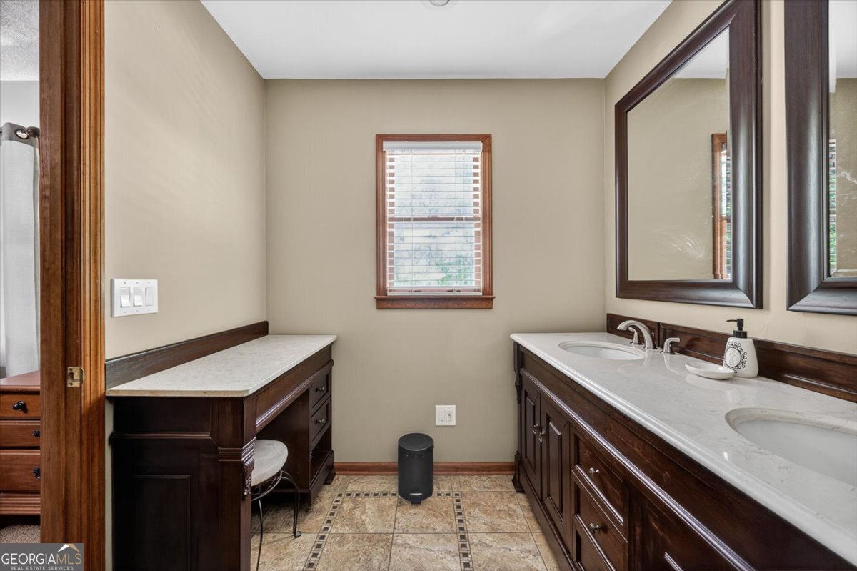 348 Craig Road Forsyth, GA 31029 - Photo 18 of 35 a bathroom with a sink and a mirror
