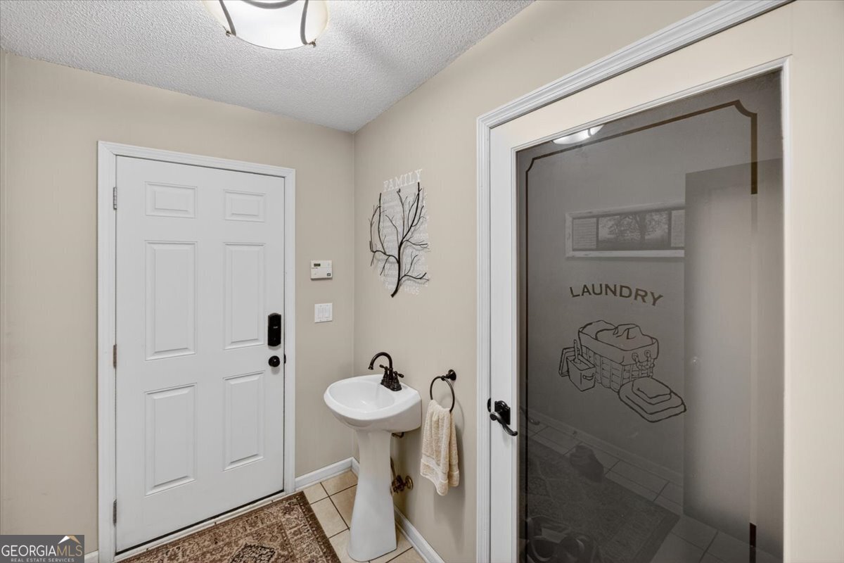 348 Craig Road Forsyth, GA 31029 - Photo 24 of 35 a bathroom with a shower