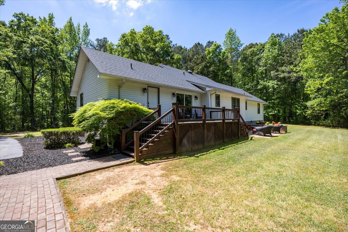 348 Craig Road Forsyth, GA 31029 - Photo 25 of 35 a view of a house with pool and sitting area