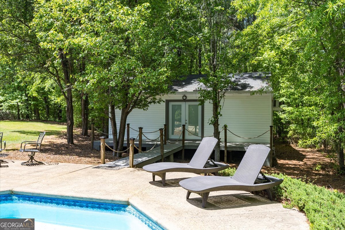 348 Craig Road Forsyth, GA 31029 - Photo 26 of 35 a view of backyard with a patio and outdoor seating