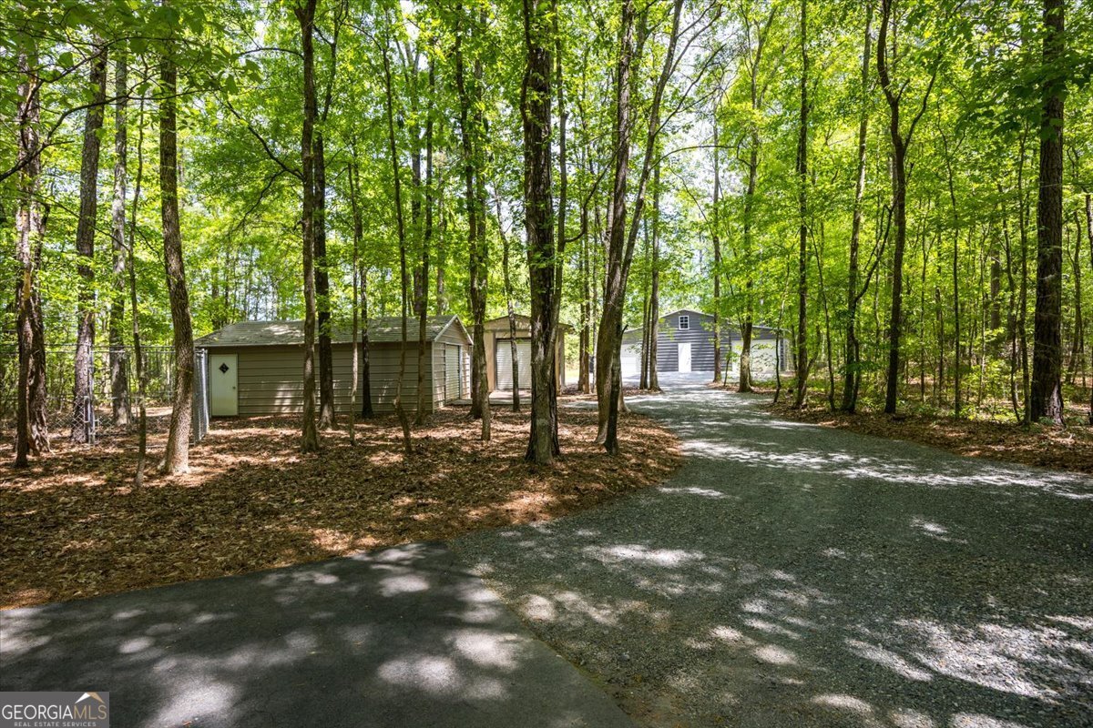 348 Craig Road Forsyth, GA 31029 - Photo 30 of 35 a view of a house with backyard and trees