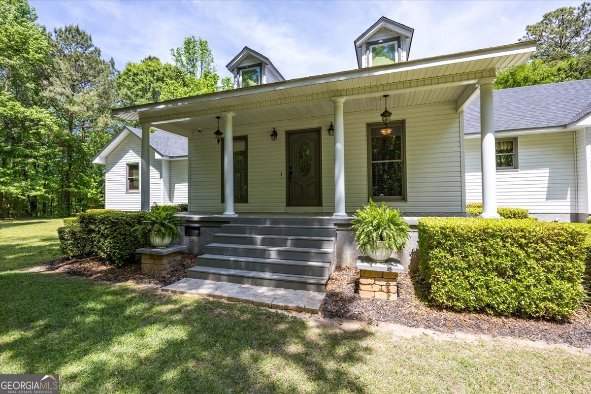 348 Craig Road Forsyth, GA 31029 - Photo 3 of 35 a front view of a house with garden