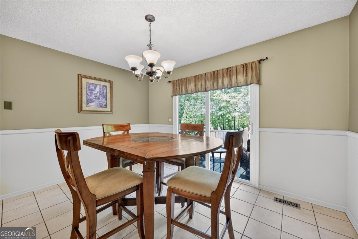 348 Craig Road Forsyth, GA 31029 - Photo 10 of 35 a view of a dining room with furniture window and outside view