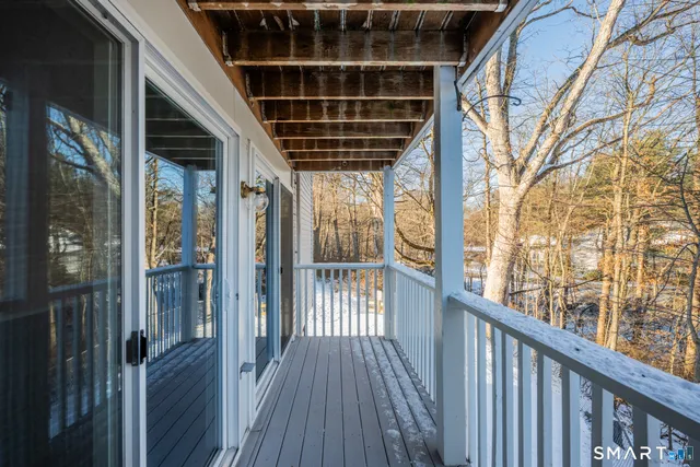 a view of balcony with wooden floor