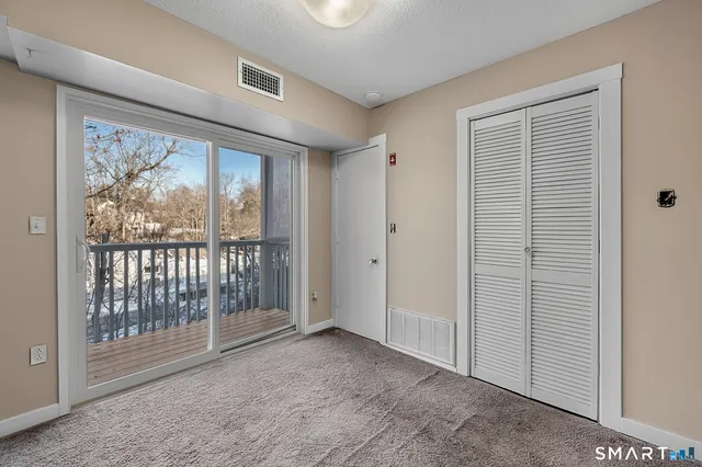 a view of a room with large windows