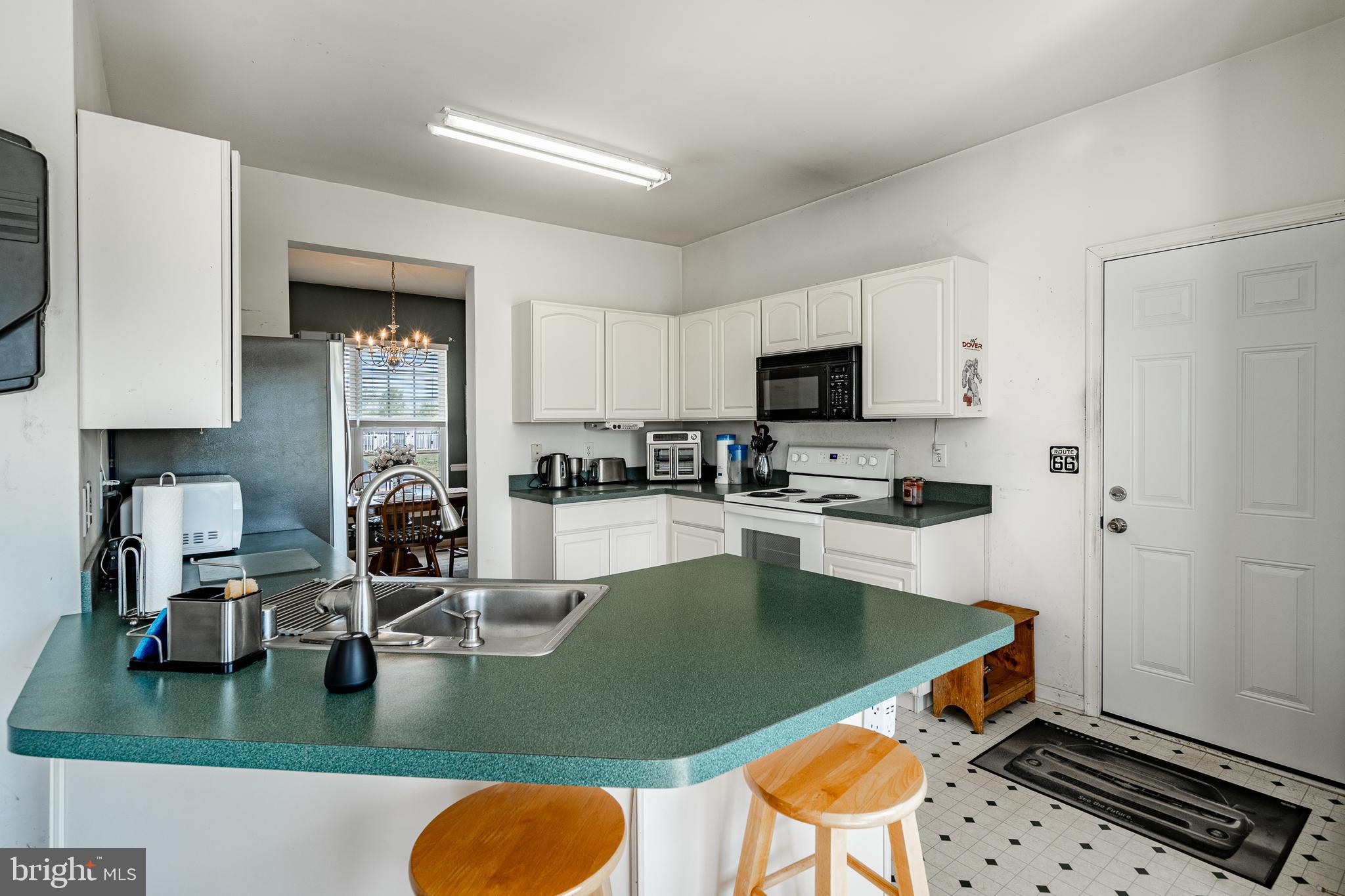 44 Ryhill Drive Dover, DE 19904 - Photo 13 of 53 a kitchen with stainless steel appliances granite countertop a sink a stove and a refrigerator
