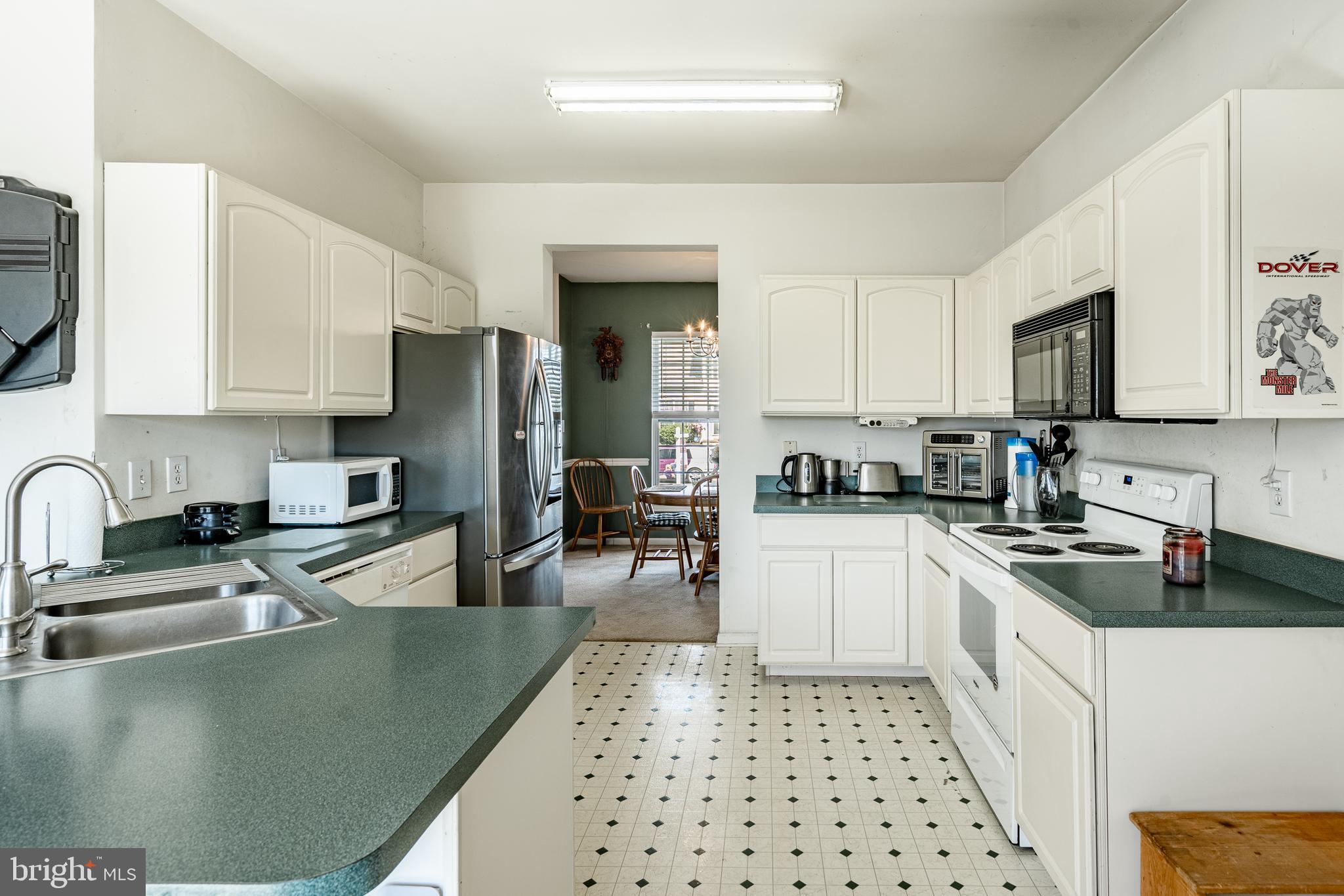 44 Ryhill Drive Dover, DE 19904 - Photo 14 of 53 a kitchen with stainless steel appliances granite countertop a sink stove and refrigerator