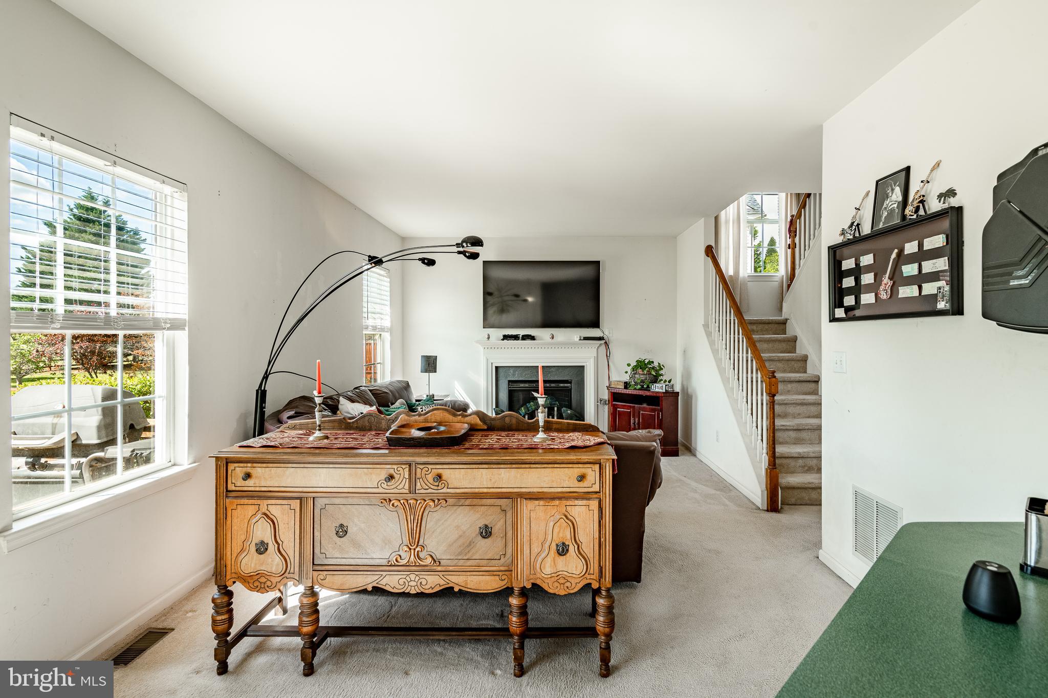 44 Ryhill Drive Dover, DE 19904 - Photo 16 of 53 a living room with furniture a fireplace and a flat screen tv