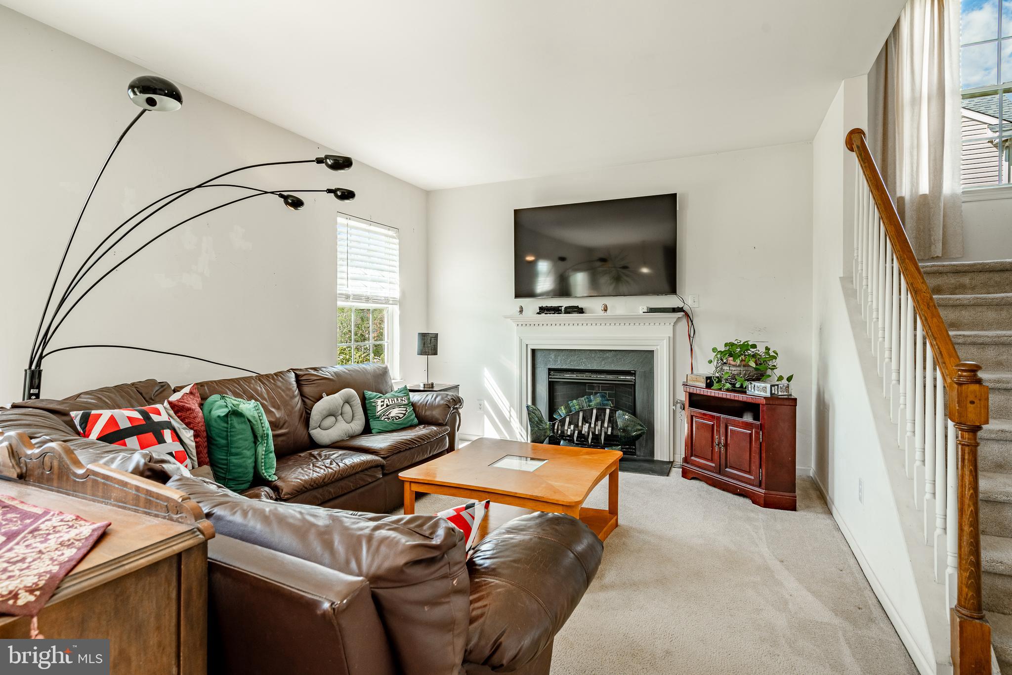 44 Ryhill Drive Dover, DE 19904 - Photo 17 of 53 a living room with furniture a flat screen tv and a fireplace