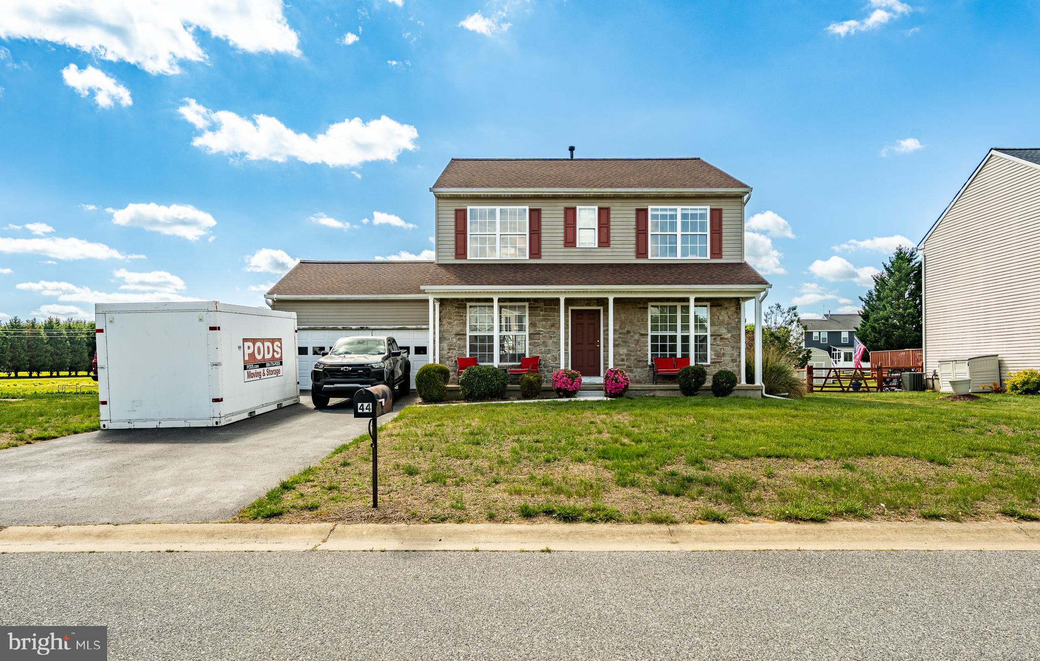 44 Ryhill Drive Dover, DE 19904 - Photo 3 of 53 a front view of a house with a yard and garage