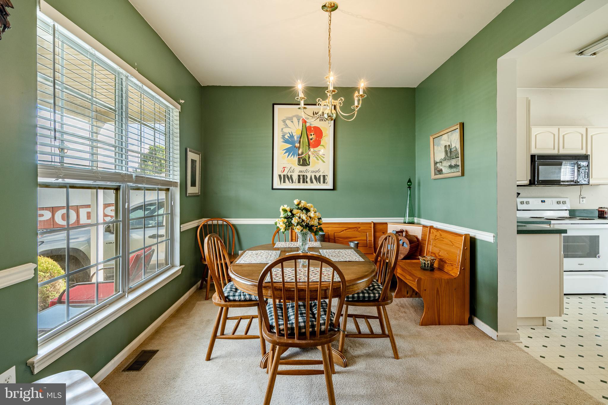 44 Ryhill Drive Dover, DE 19904 - Photo 9 of 53 a view of a dining room with furniture a chandelier and window