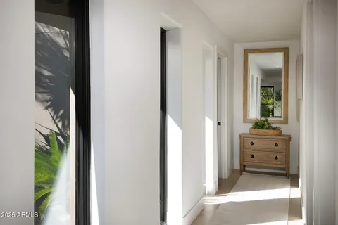 a bathroom with a granite countertop toilet sink and mirror