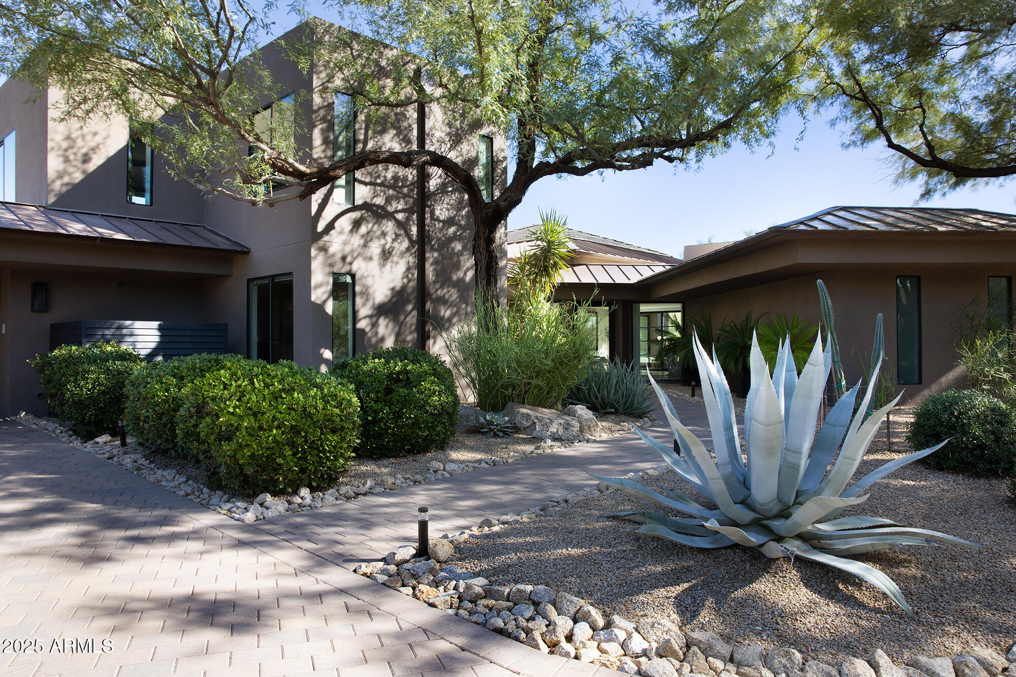 10040 East Happy Valley Road, Unit 626 Scottsdale, AZ 85255 - Photo 30 of 30 a front view of a house with garden