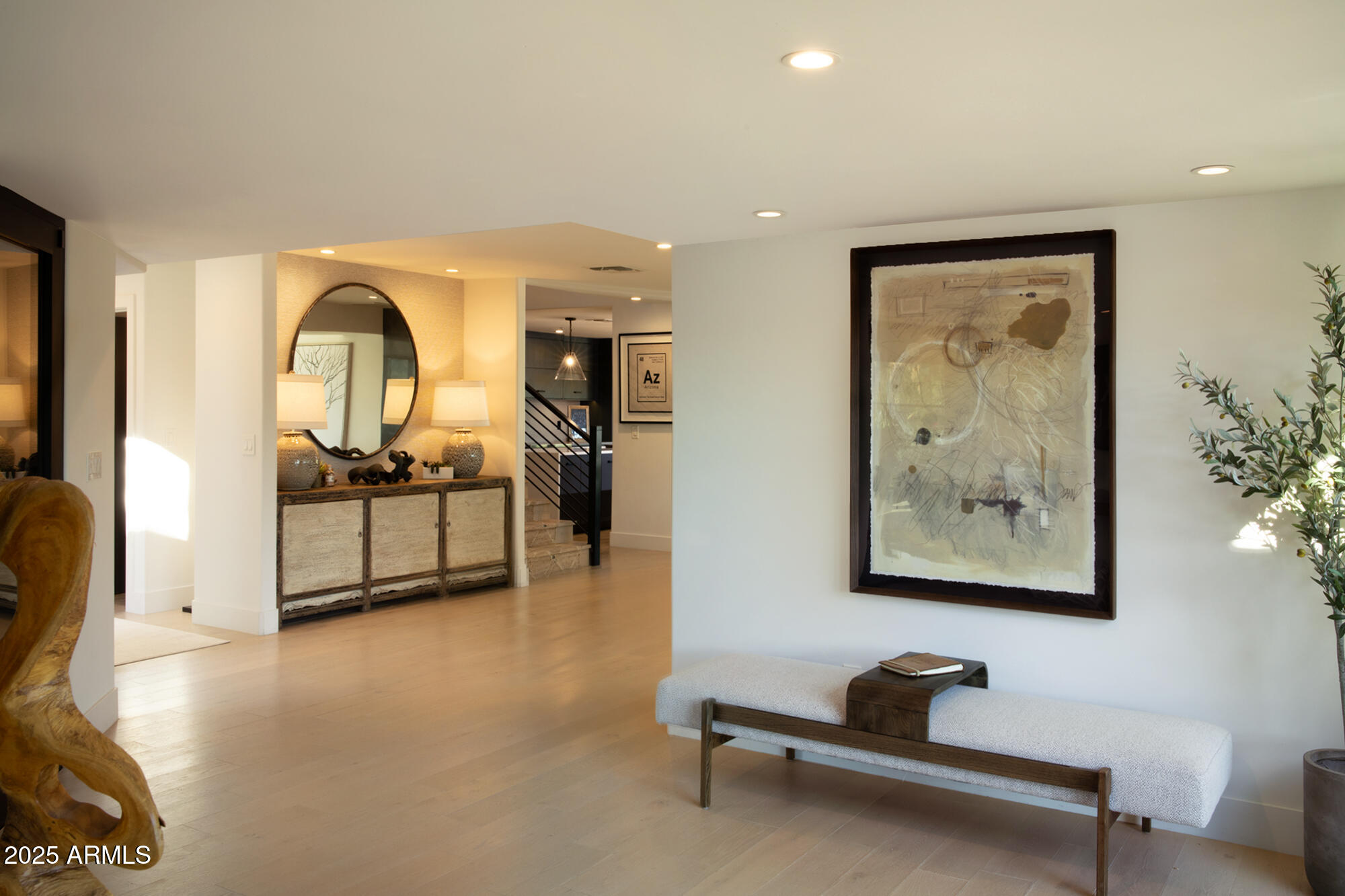 10040 East Happy Valley Road, Unit 626 Scottsdale, AZ 85255 - Photo 4 of 30 a living room with furniture gym equipment and a painting on the wall