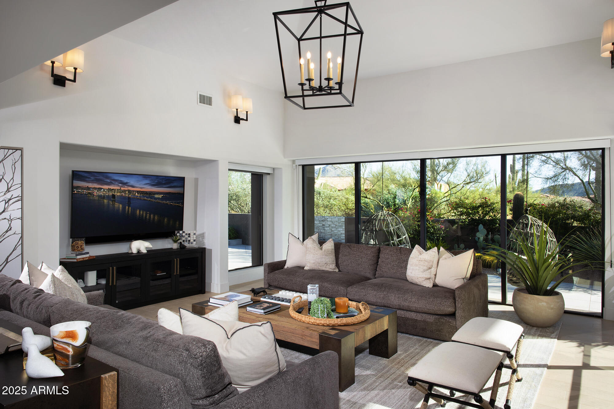 10040 East Happy Valley Road, Unit 626 Scottsdale, AZ 85255 - Photo 5 of 30 a living room with furniture and a flat screen tv