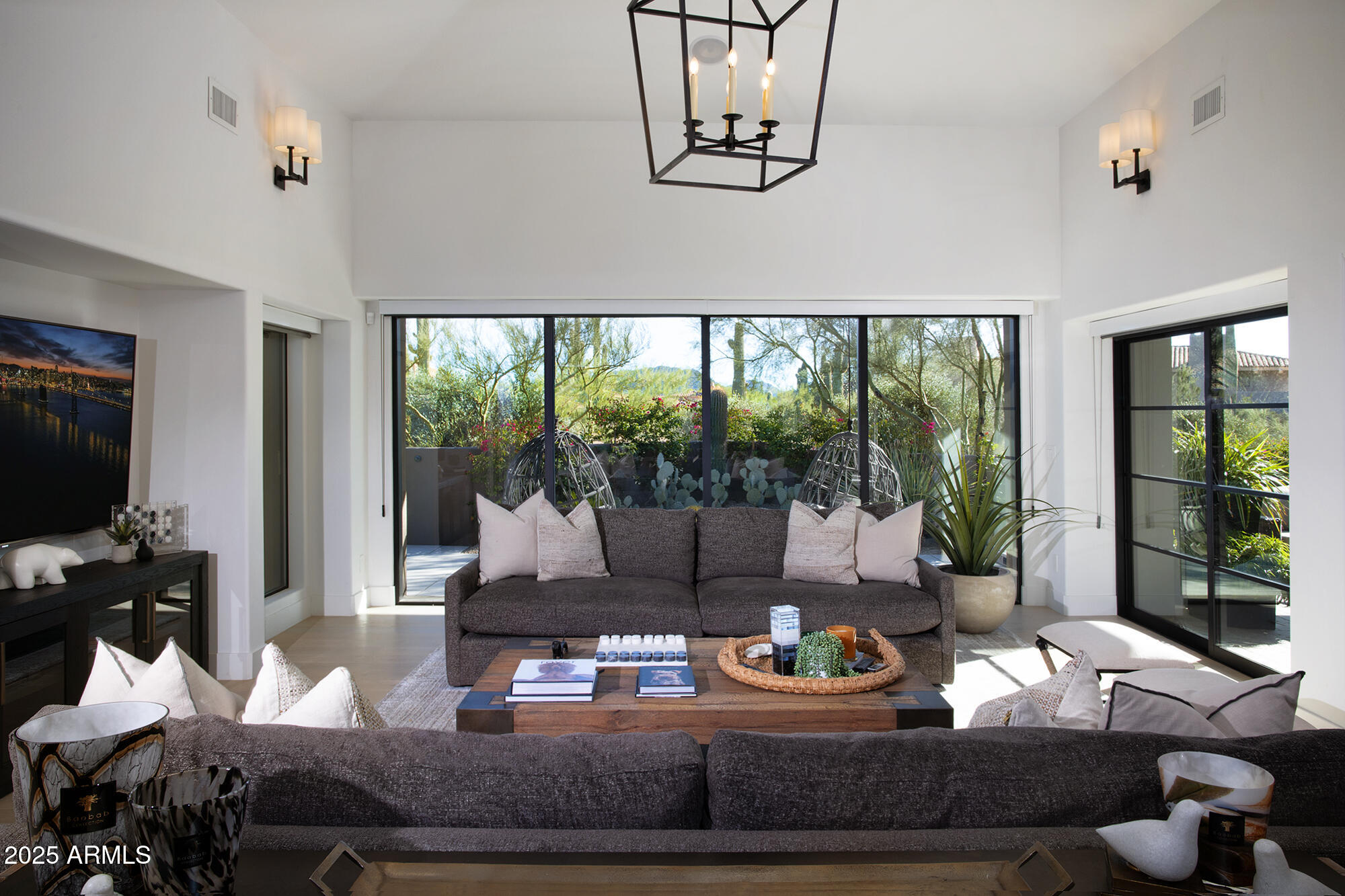 10040 East Happy Valley Road, Unit 626 Scottsdale, AZ 85255 - Photo 7 of 30 a living room with furniture and a large window
