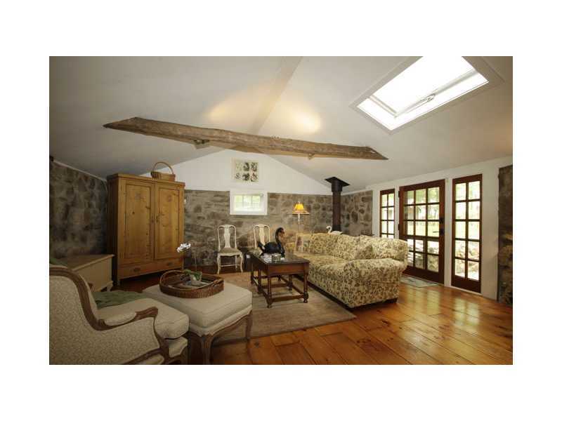 131 Journeys End Road Wilton, CT 06897 - Photo 8 of 25 a living room with furniture and a large window