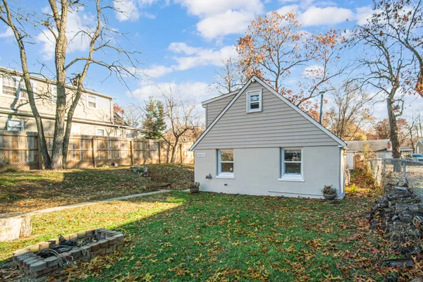 a house that has a tree in front of the house
