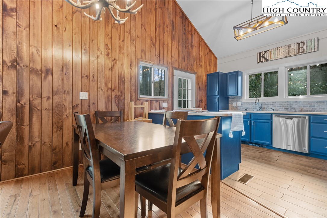 101 Pond Creek Road Banner Elk, NC 28604 - Photo 14 of 35 a view of a dining room with furniture window and wooden floor