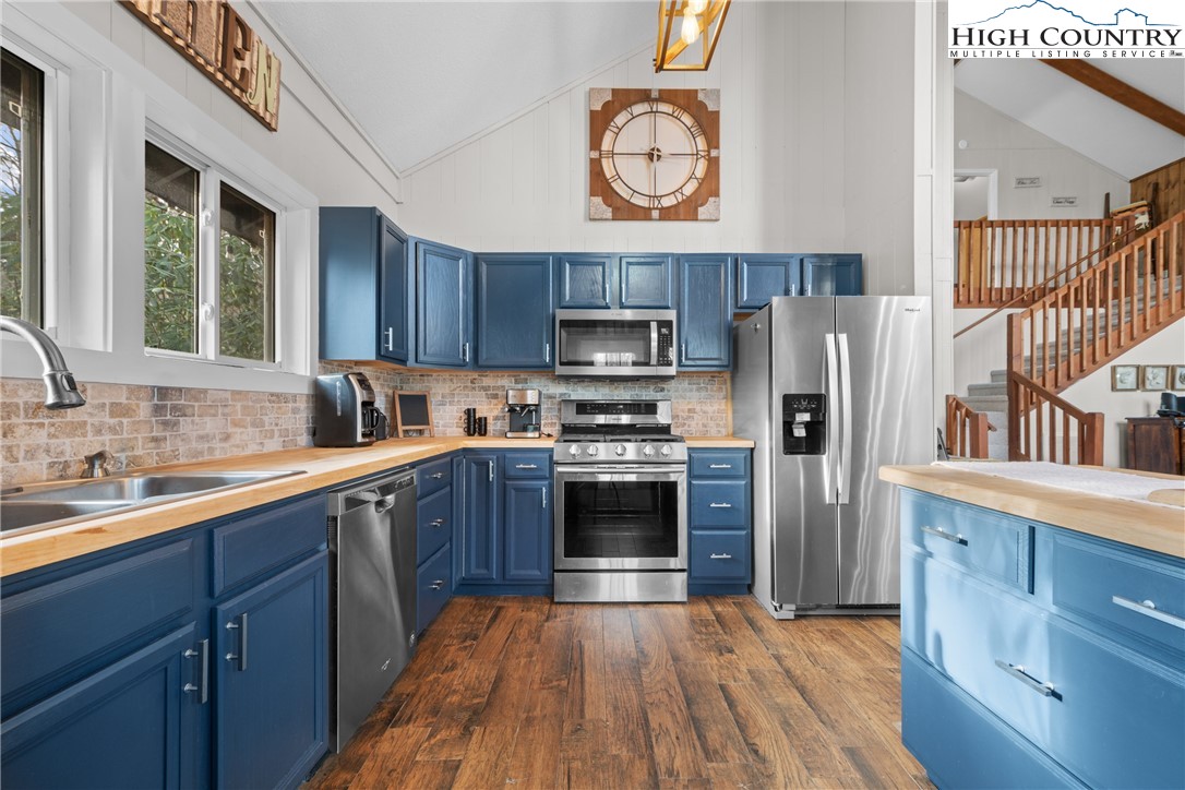 101 Pond Creek Road Banner Elk, NC 28604 - Photo 16 of 35 a kitchen with stainless steel appliances granite countertop a refrigerator stove top oven and sink