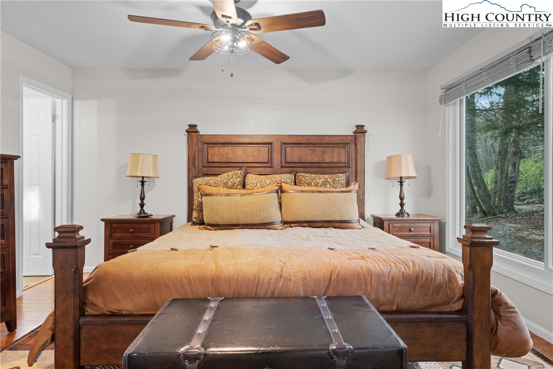101 Pond Creek Road Banner Elk, NC 28604 - Photo 21 of 35 a bedroom with a bed and a large window