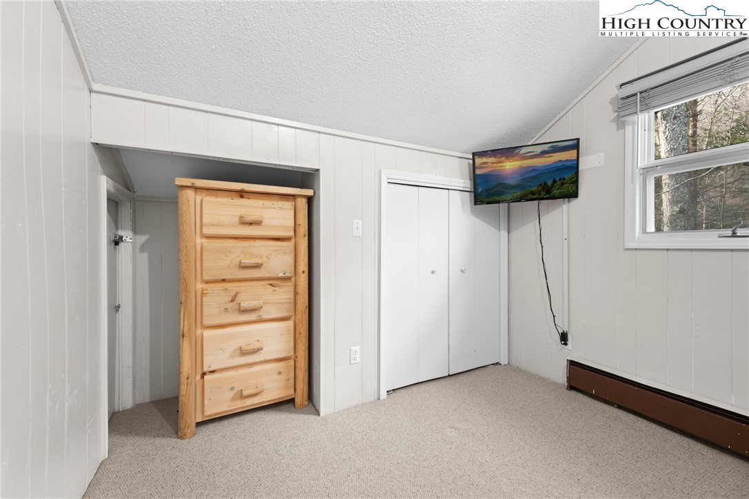 101 Pond Creek Road Banner Elk, NC 28604 - Photo 27 of 35 an empty room with windows and closet