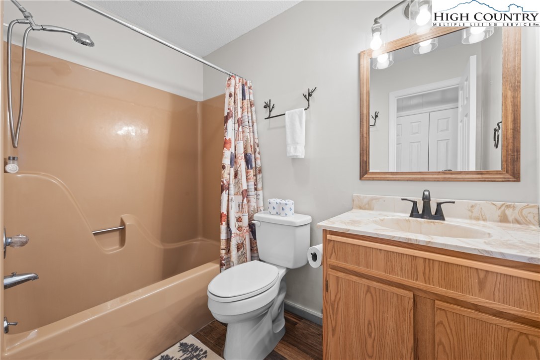 101 Pond Creek Road Banner Elk, NC 28604 - Photo 28 of 35 a bathroom with a sink a toilet and shower