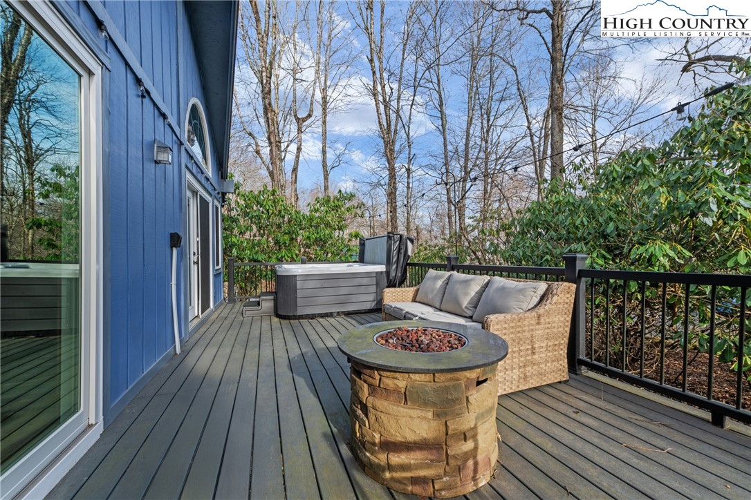 101 Pond Creek Road Banner Elk, NC 28604 - Photo 32 of 35 a balcony with furniture and wooden floor
