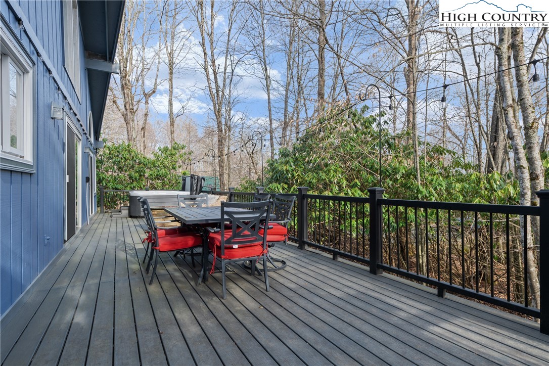 101 Pond Creek Road Banner Elk, NC 28604 - Photo 33 of 35 a balcony with wooden floor table and chairs