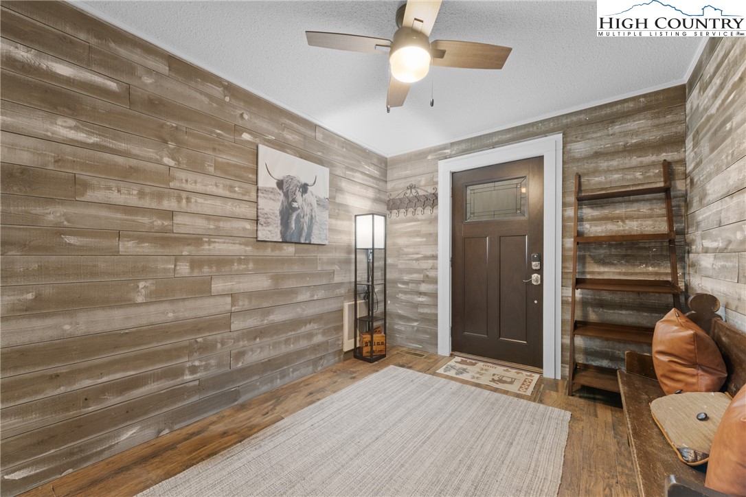 101 Pond Creek Road Banner Elk, NC 28604 - Photo 7 of 35 a view of livingroom with hardwood floor and a ceiling fan