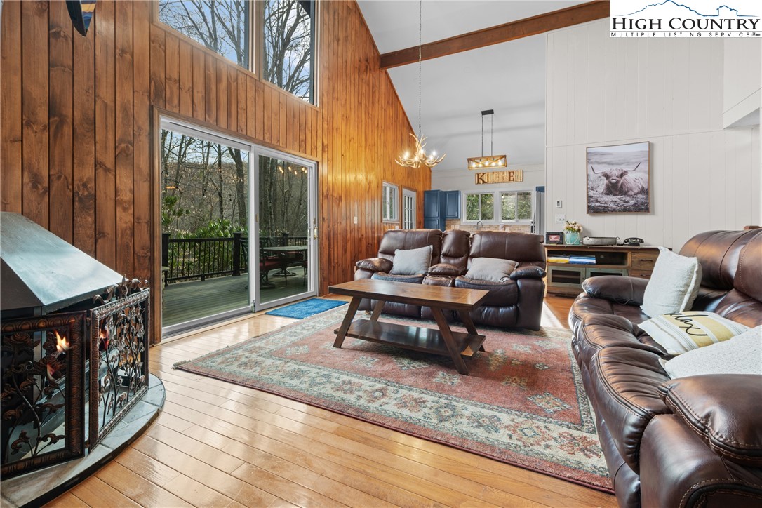101 Pond Creek Road Banner Elk, NC 28604 - Photo 10 of 35 a living room with furniture a large window and a rug