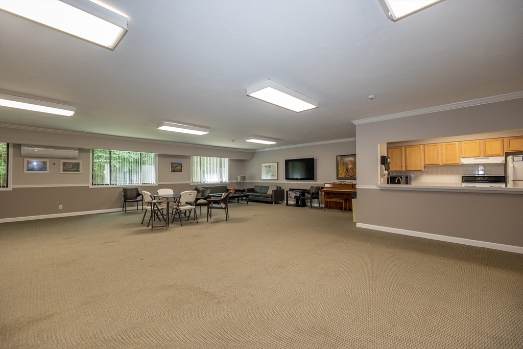 1500 Worcester Road, Unit 217 Framingham, MA 01702 - Photo 28 of 37 a view of a livingroom with furniture and a window