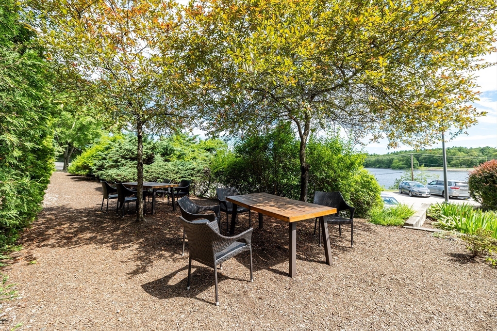 1500 Worcester Road, Unit 217 Framingham, MA 01702 - Photo 32 of 37 a view of a backyard with sitting area