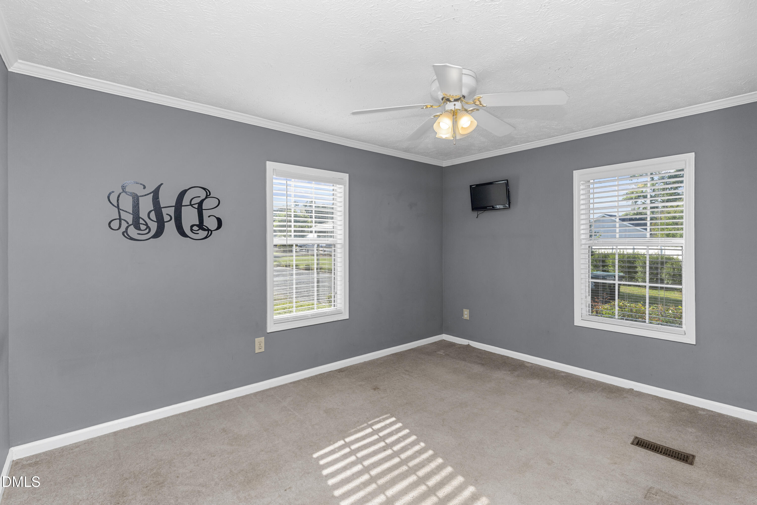199 Iris Bryant Road Erwin, NC 28339 - Photo 14 of 33 a view of wooden floor and windows in a room