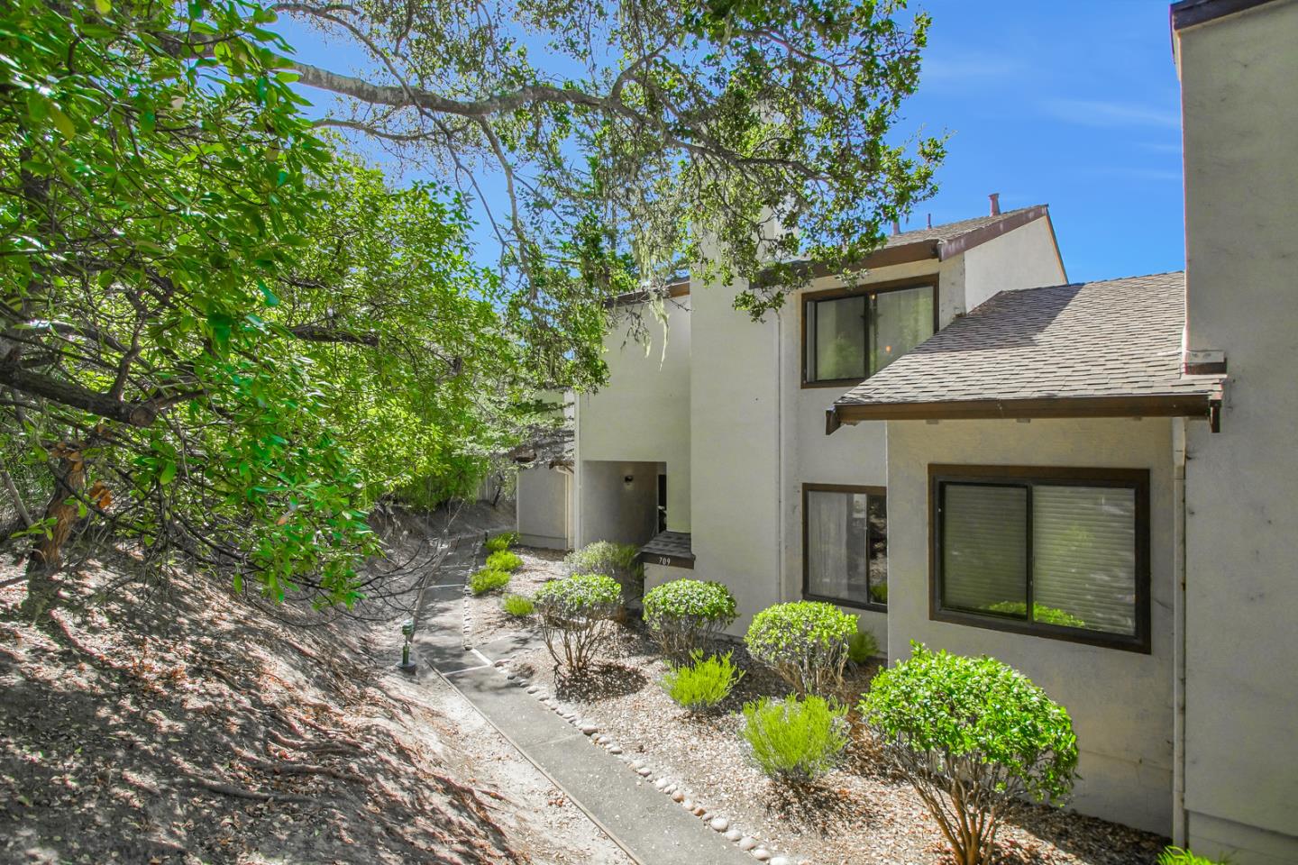 709 Timber Trail Pacific Grove, CA 93950 - Photo 2 of 19 a front view of a house with garden