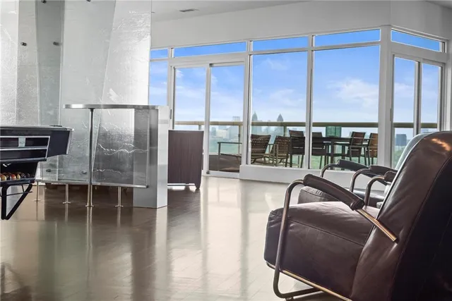 a kitchen with stainless steel appliances granite countertop a refrigerator and a stove