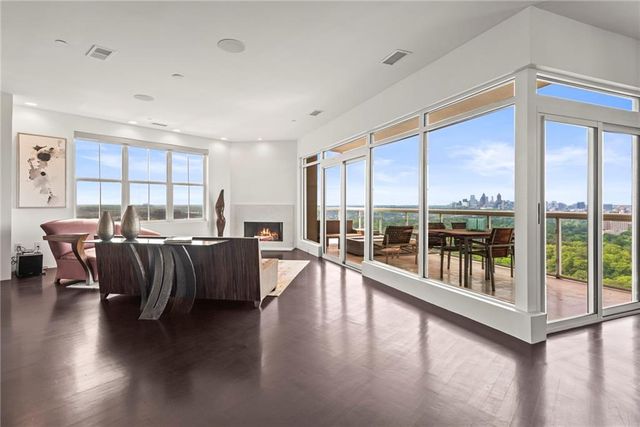 a kitchen with stainless steel appliances granite countertop a sink and a refrigerator