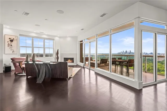 a kitchen with stainless steel appliances granite countertop a sink and a refrigerator