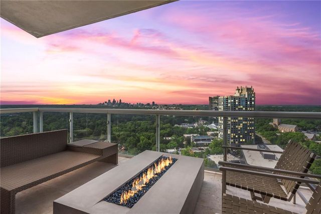 a kitchen with stainless steel appliances granite countertop a sink and a refrigerator