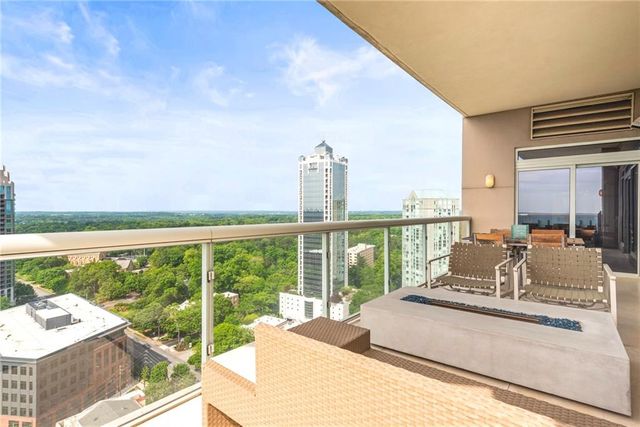a living room with furniture and large window