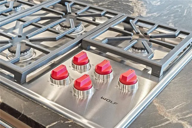 a view of a kitchen with a sink and windows