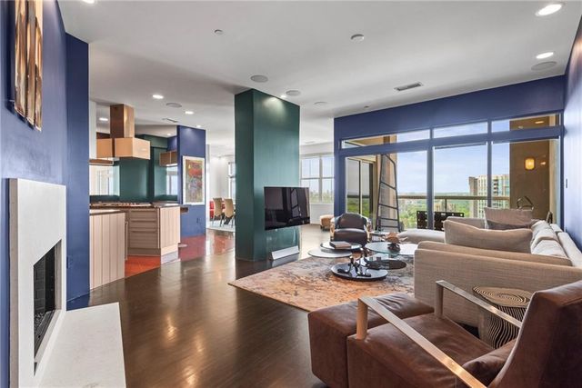 a bathroom with a granite countertop sink a mirror and shower